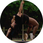 Chinyere doing a pole assisted back bend out in nature.