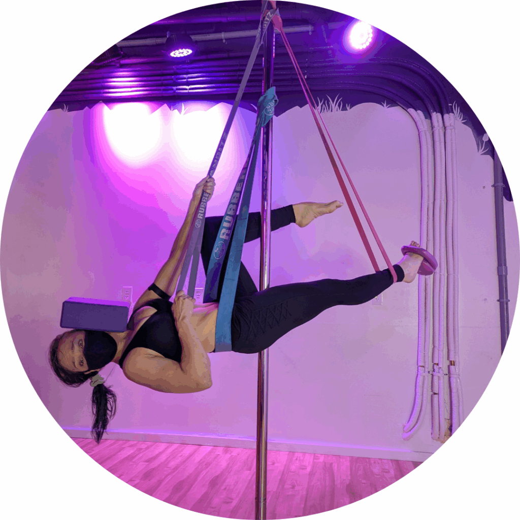 Kricket suspended from a pole with Rubberbanditz and a block on their head.