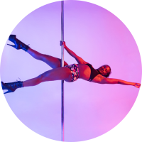 A BIPOC fem-presenting person does an extended pole sit against a light purple background.